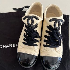 Chanel cream lamb skin leather with black patent leather cap toe sneakers